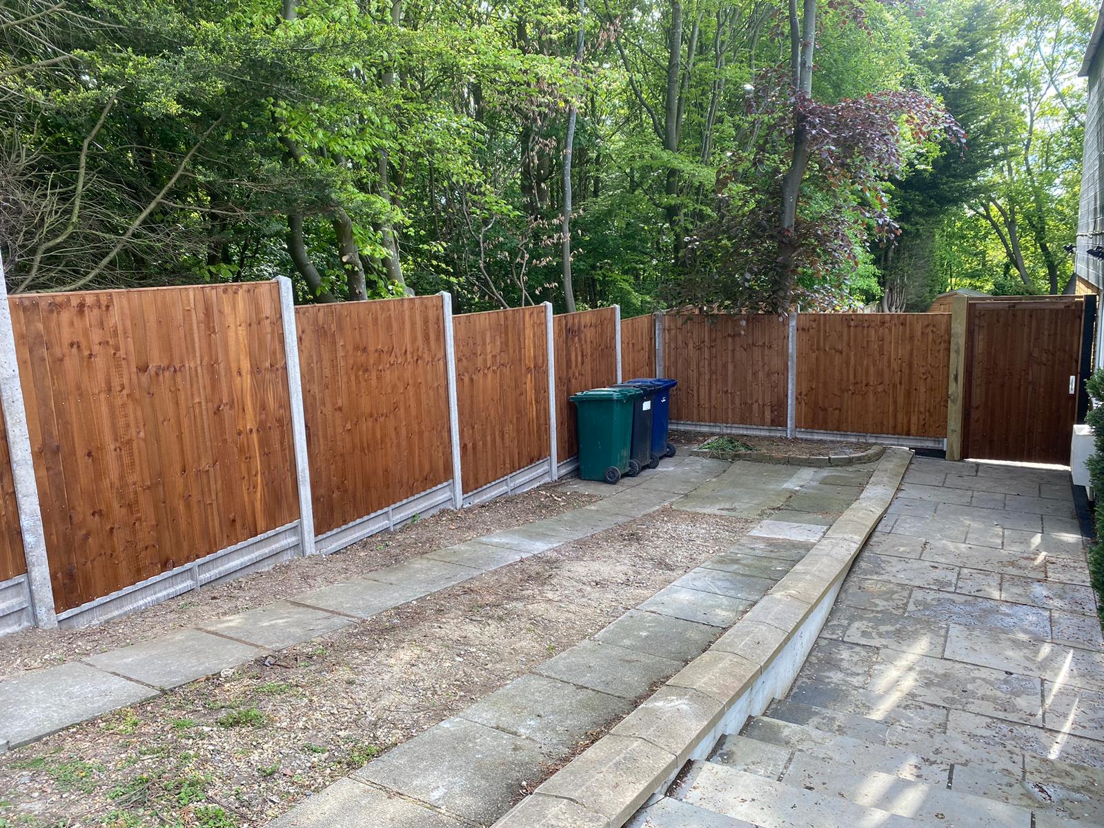 An image showing 6 new fence panels installed to back garden with concrete posts