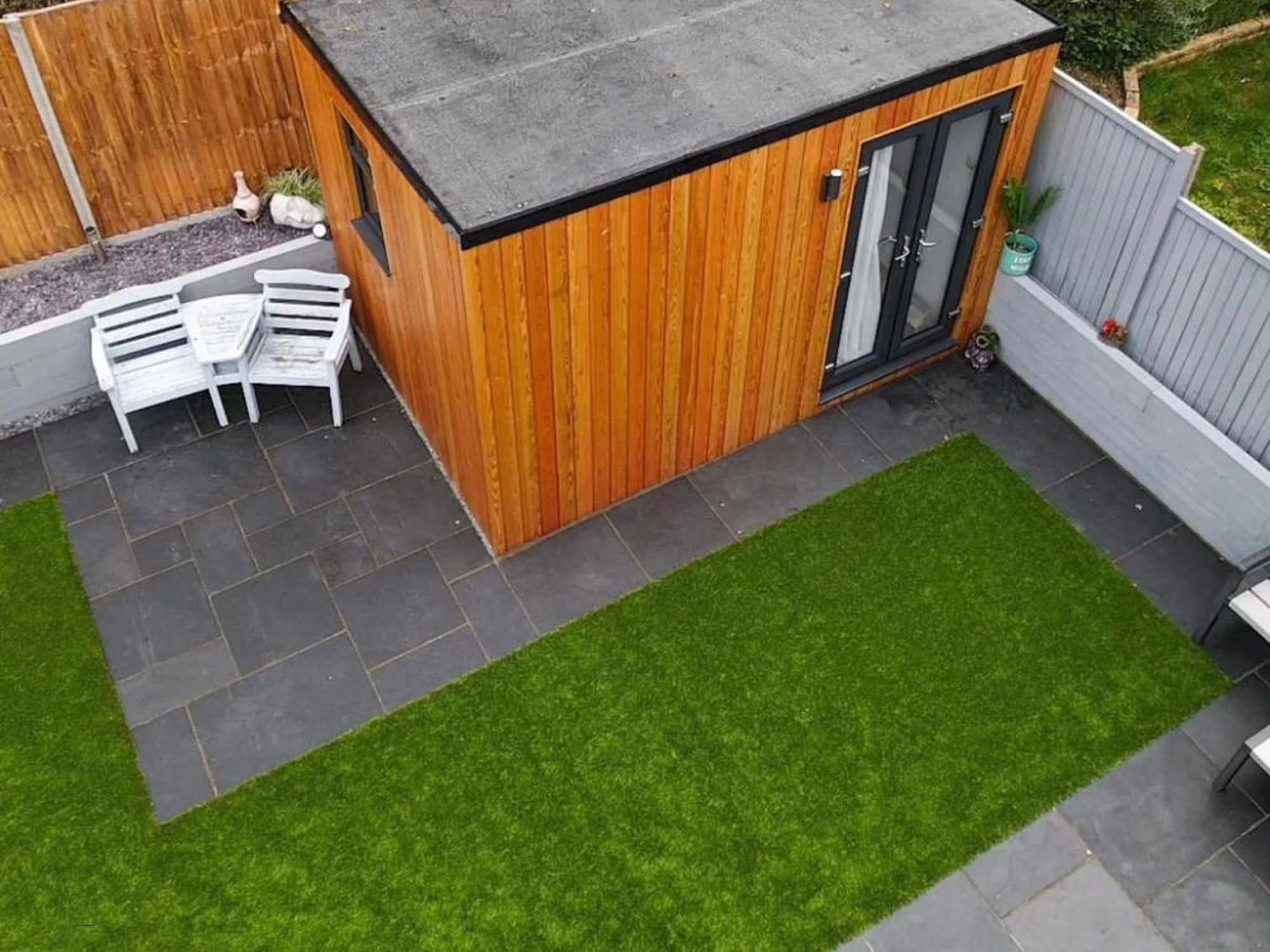 An aerial view of a garden showing newly laid turf and patio