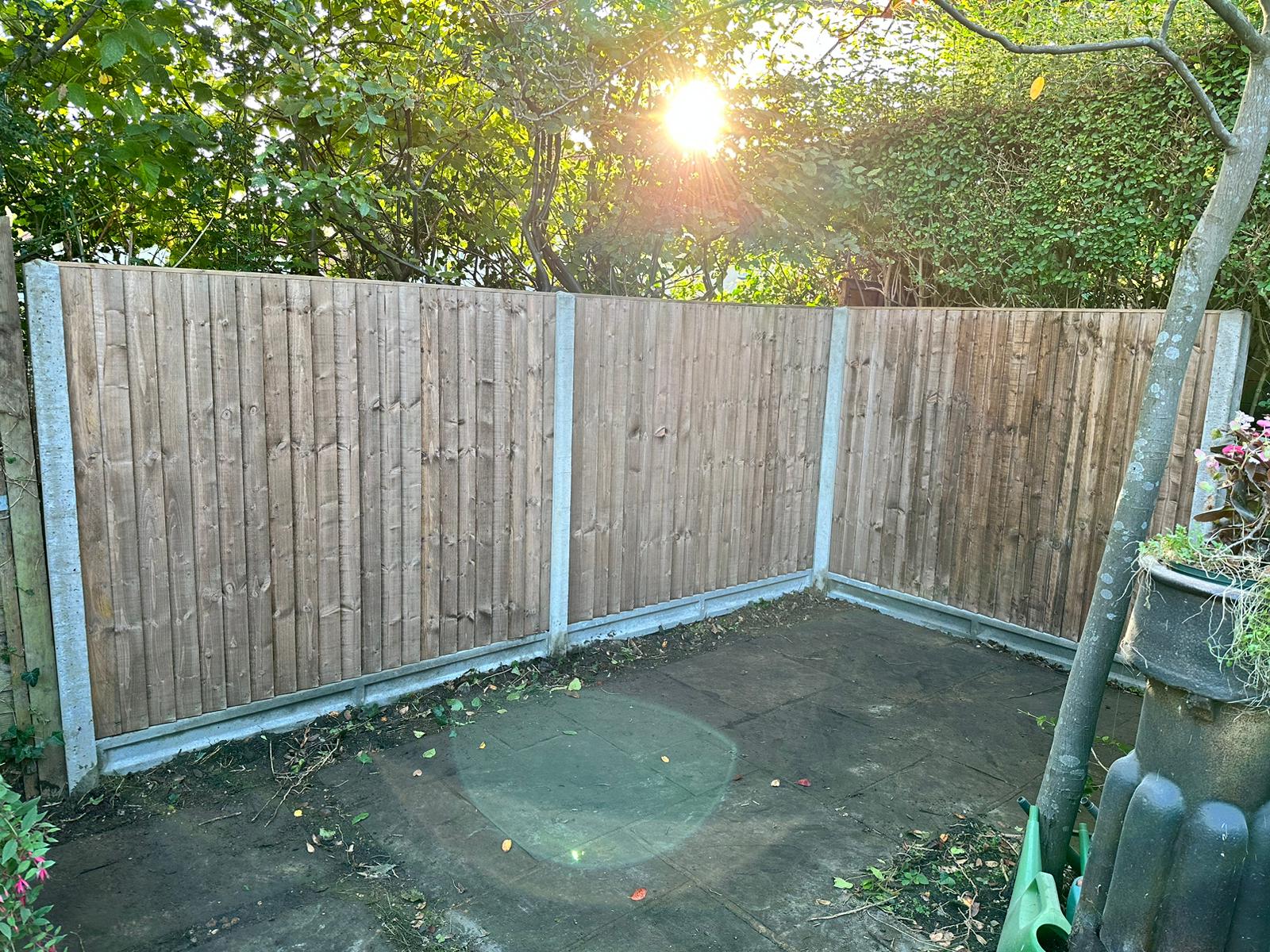 An image showing new Fence Panels and Posts installed in a back garden.