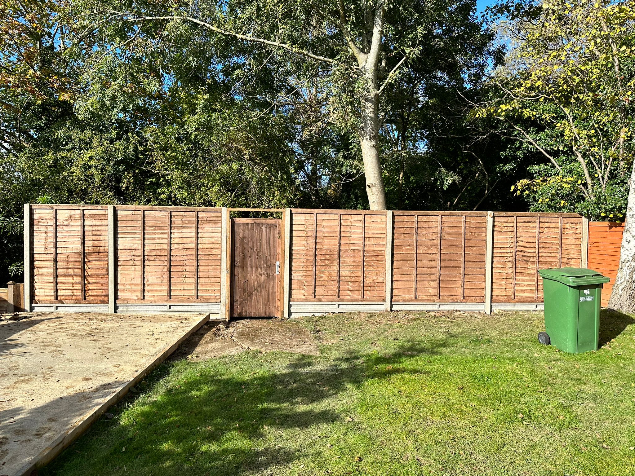 An image showing new Fence Panels and Posts installed in a back garden.