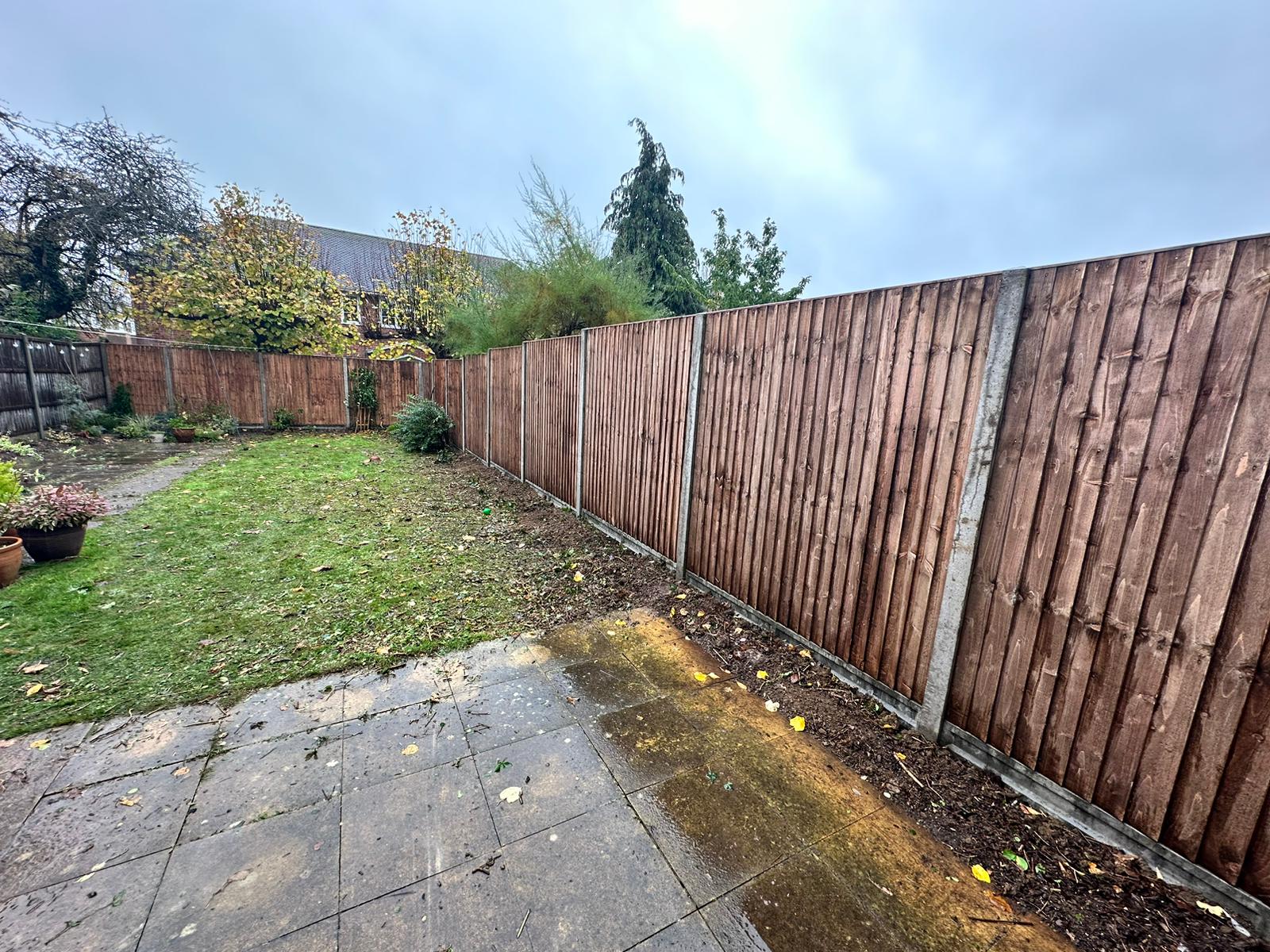 An image showing new Fence Panels and Posts installed in a back garden.