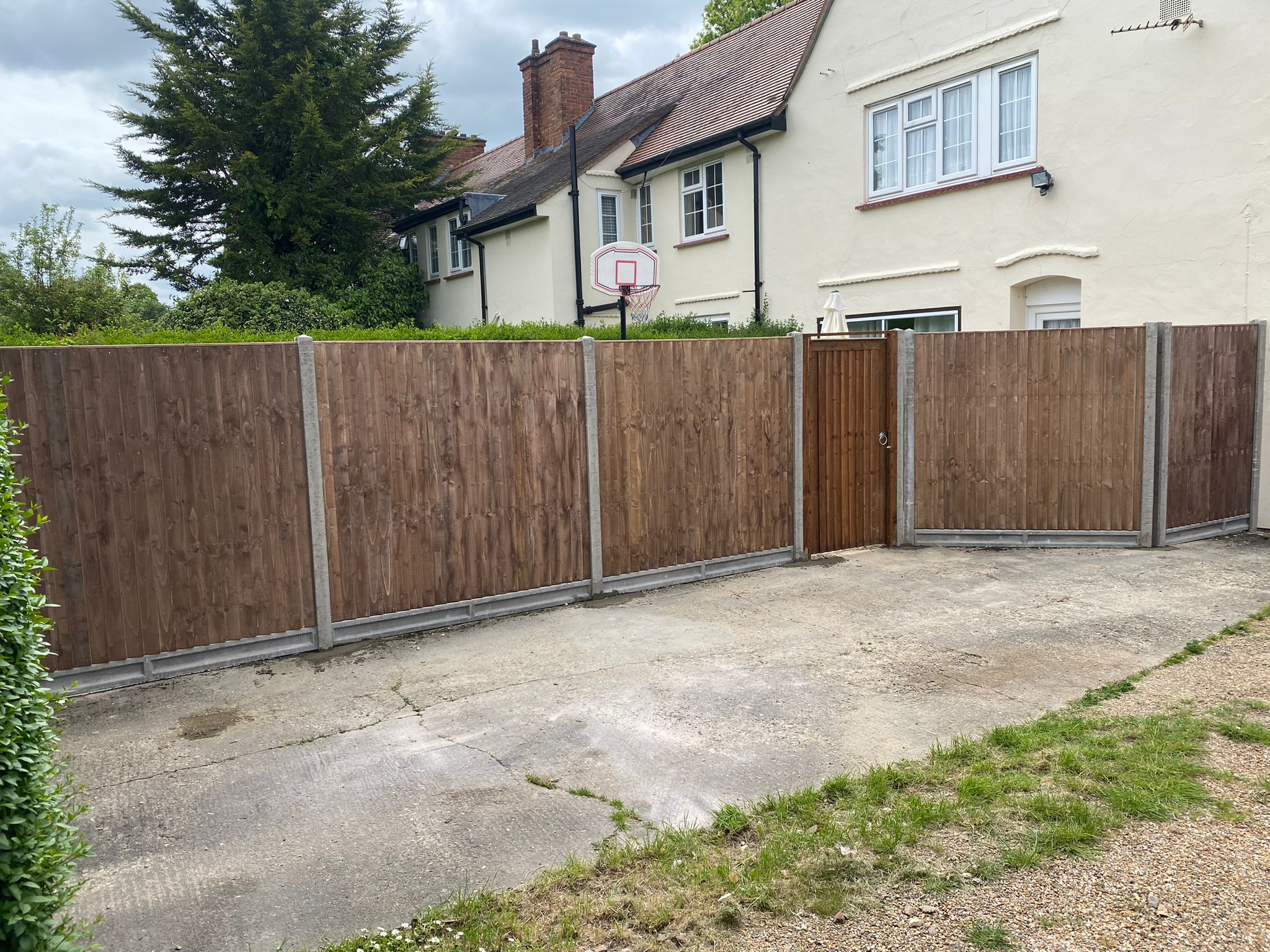 An image showing new Fence Panels and Posts installed in a back garden.
